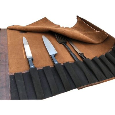 Elastic pockets hold knives inside Buffalo leather