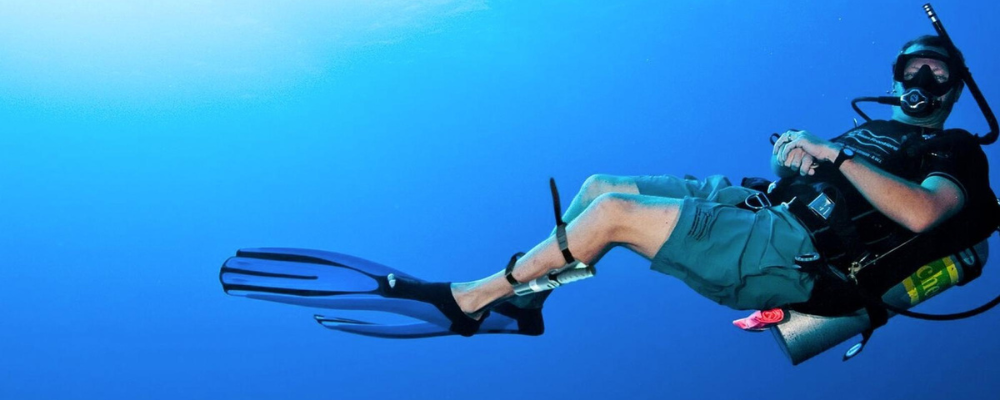 A diver with his dive knife strapped to his left calf