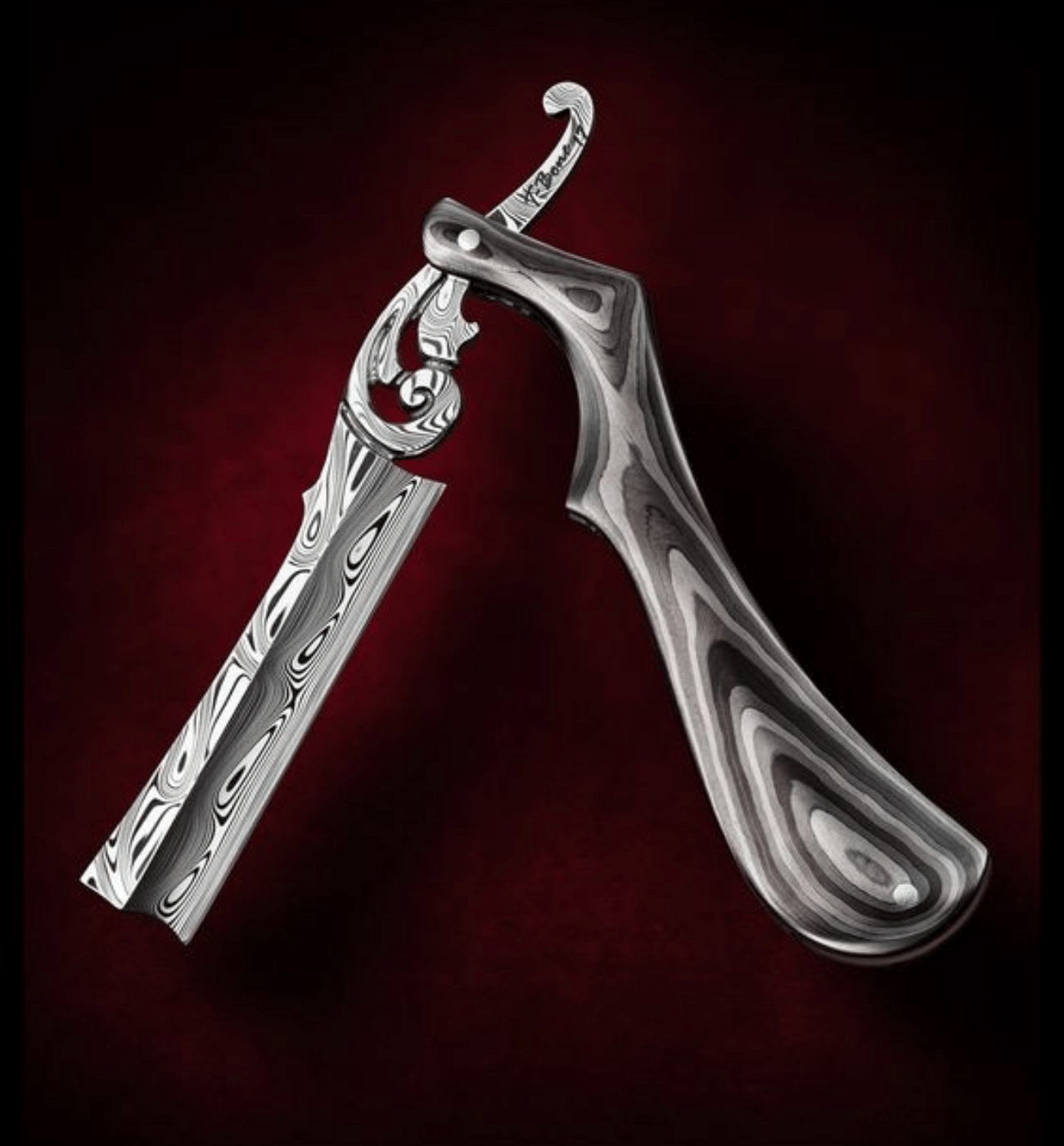 A custom Damascus Barber Knife with custom handle for the demanding man!