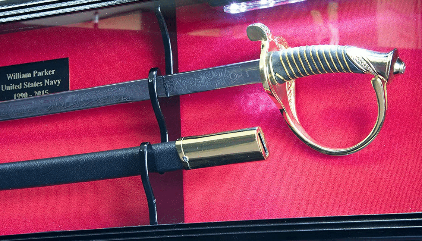 A US Naval Service Sword in a display case with red background