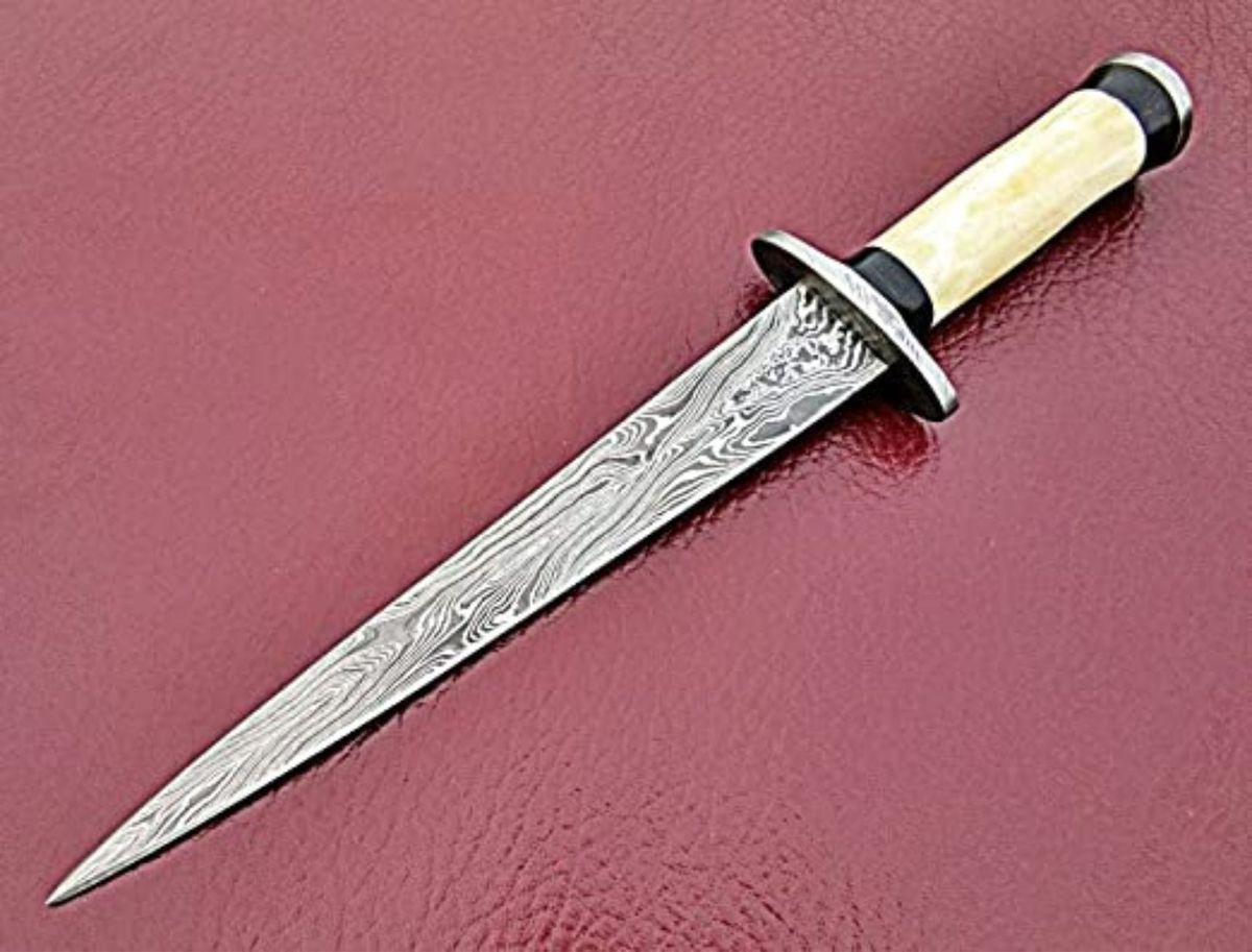 Damascus Arkansas Toothpick on red countertop