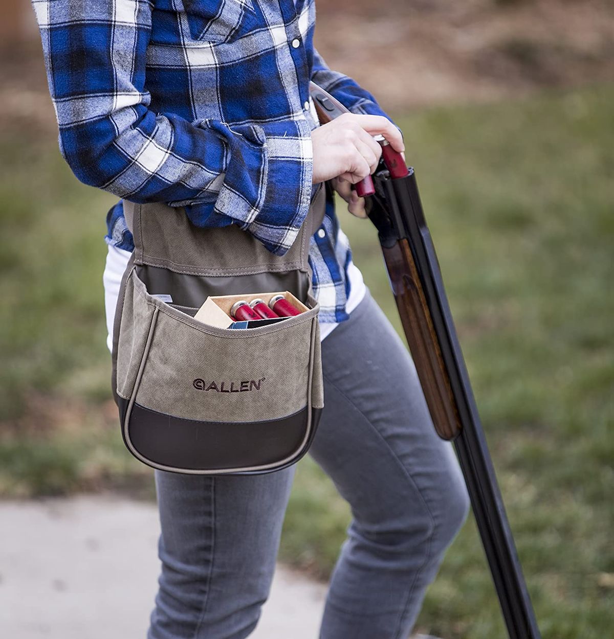 A man with his double barreled shotgun, reloading at his trap range, ready for the next clay pigeon!