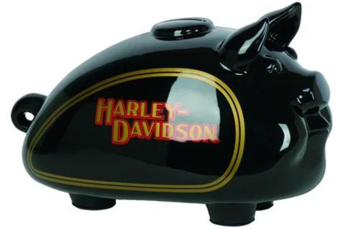 The black classic Harley logo with gold pinstripes and letters shadowed in red.