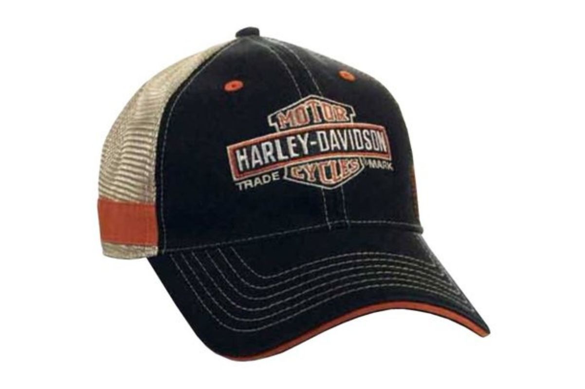 A HD Bar and Shield trucker hat, black, orange and dirty white.