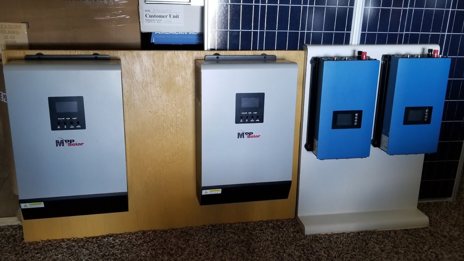 A panel containing 4 hybrid inverters in a grid-tie sytem