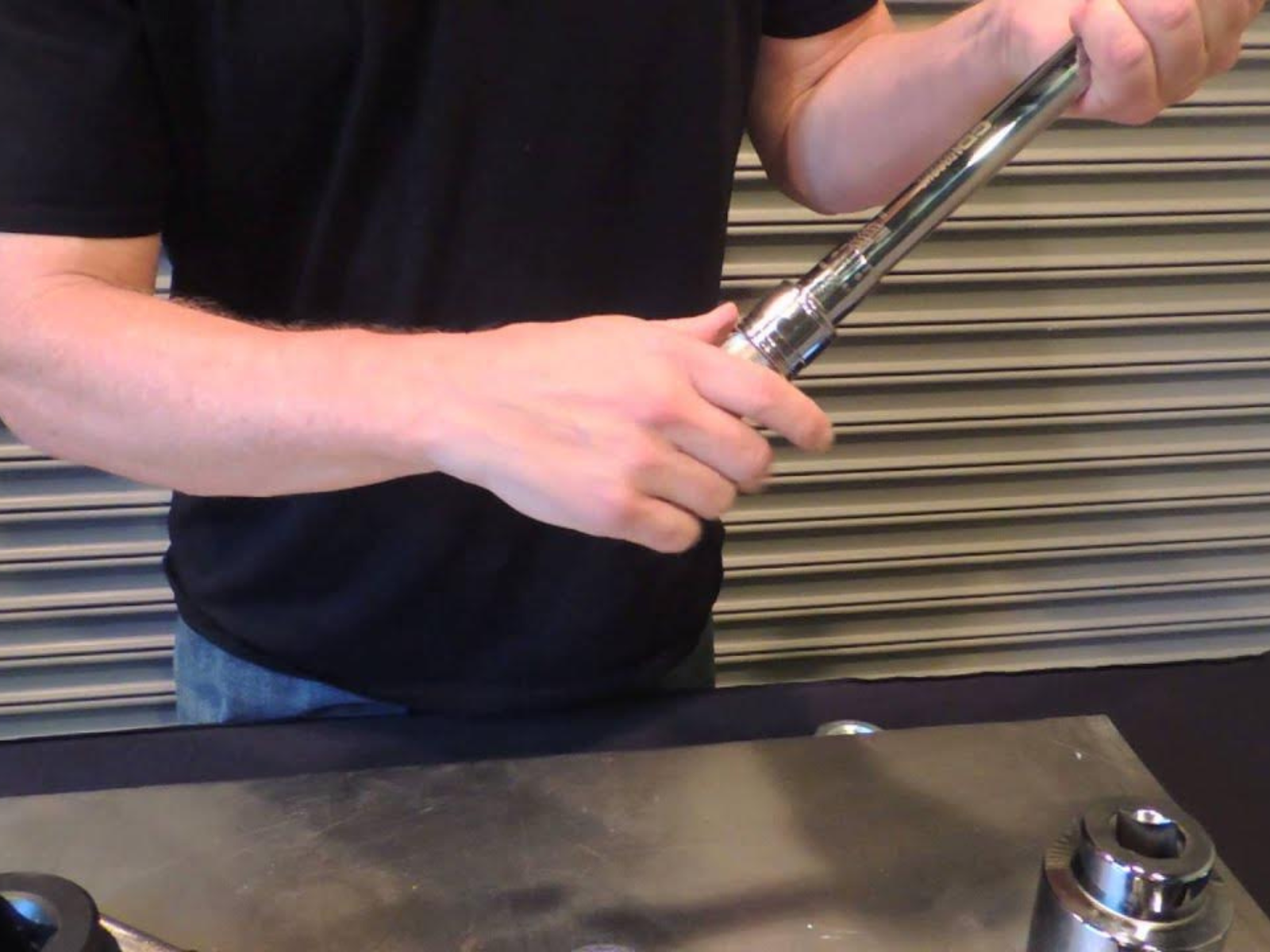 A man adjusting his torque wrench by CDI