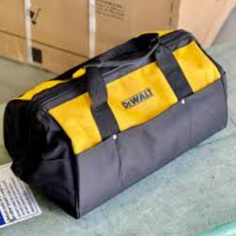 A small DeWalt tool bag sitting on a concrete floor.