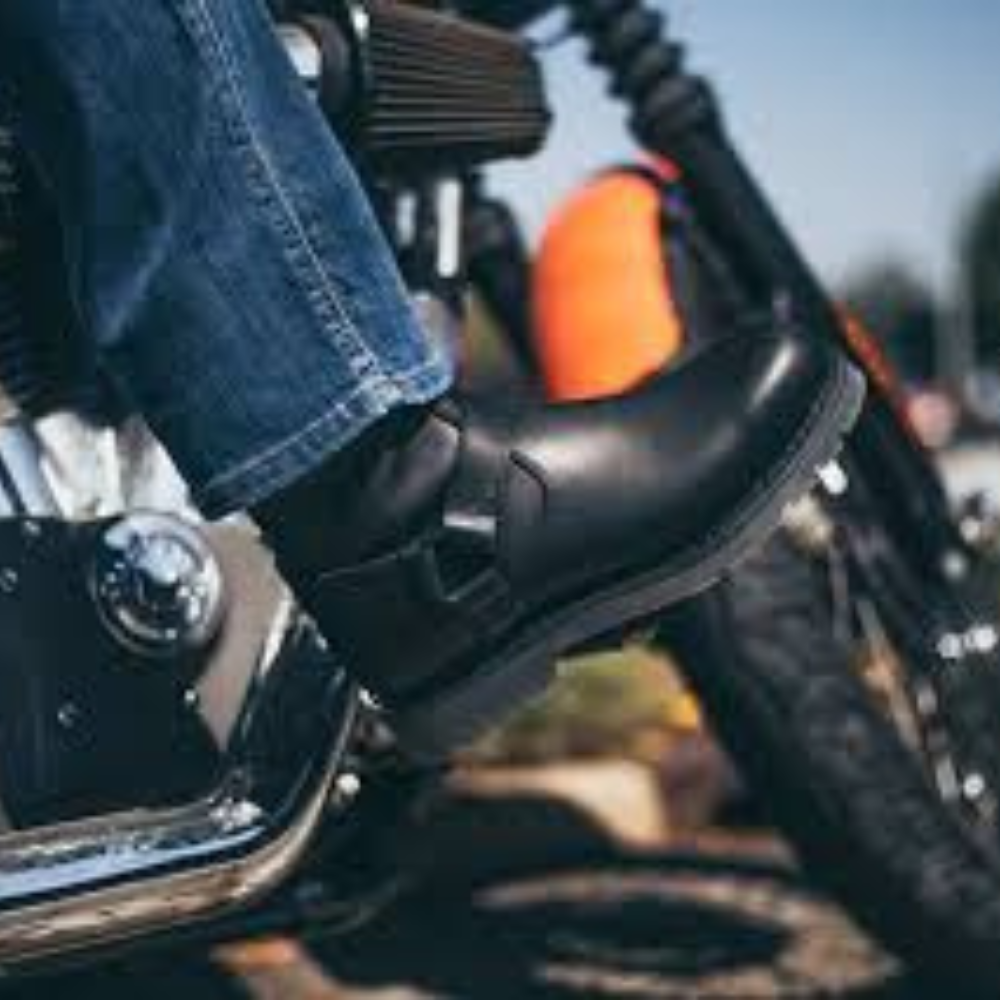 A man wearing Harley Davidson Bill Steel Toe Boots on a motorcycle.