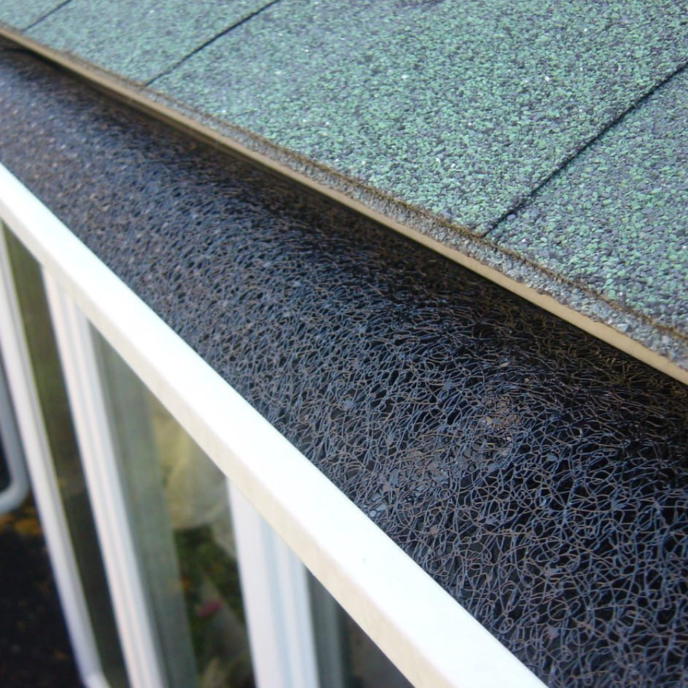 Foam installed in a gutter to prevent leaves and debris from entering the gutter system.